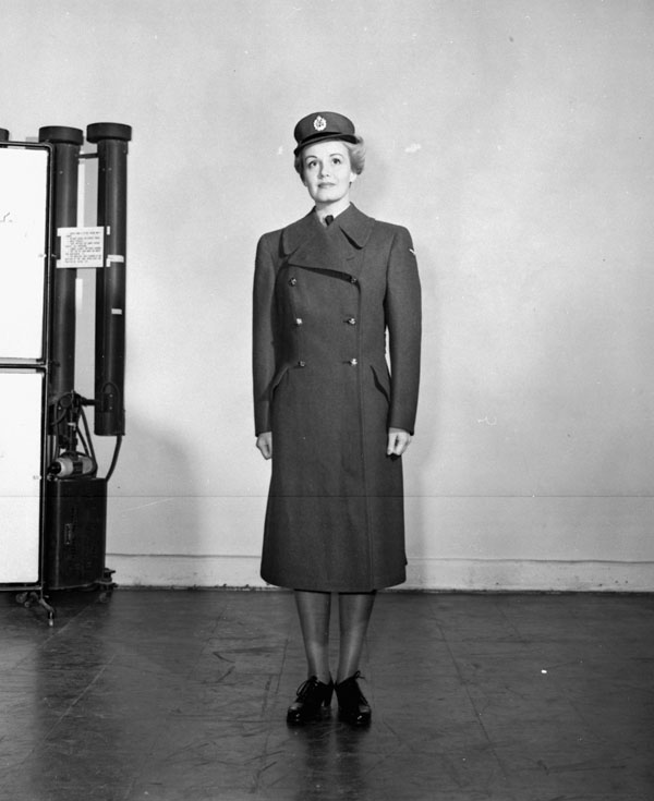 Unidentified airwoman modelling the uniform of the R.C.A.F. Women's Division, R.C.A.F. Station Rockcliffe, Ontario, Canada, 10 July 1942.