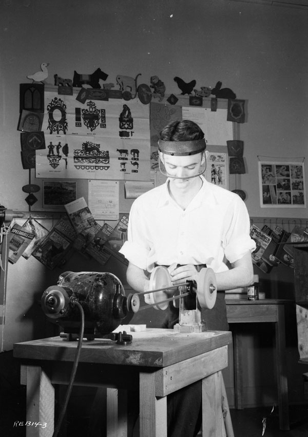 Unidentified airman working in the Station Hospital's craft shop, R.C.A.F. Station Rockcliffe, Ontario, Canada, 5 April 1944.