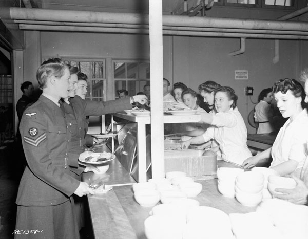 Unidentified airwomen lining up in the cafeteria, No.1 Repatriation Depot (Canadian Army Miscellaneous Units), Royal Canadian Air Force Station Rockcliffe, Ontario, Canada, 24 April 1944.