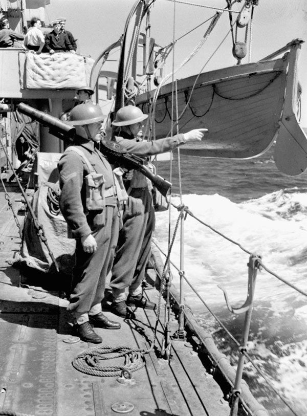 Infantrymen of the 1st Battalion, The Black Watch (Royal Highland Regiment) of Canada, aboard H.M.C.S. OTTAWA en route to Botwood, Newfoundland, 22 June 1940.