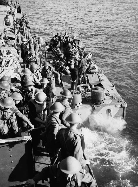 Infantrymen of The Queen's Own Cameron Highlanders of Canada going ashore during Operation JUBILEE, the raid on Dieppe, France, 19 August 1942.