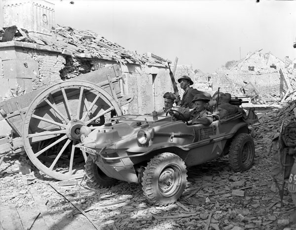 Personnel of the South Saskatchewan Regiment in captured Germany. 'Schwimmwagen' amphibious car of the Wehrmacht, Rocquancourt, France, 11 August 1944.