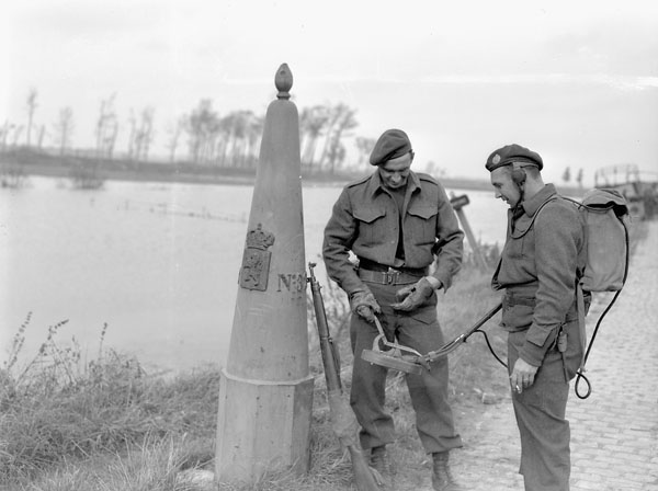 Sappers of the Royal Canadian Engineers (R.C.E.), 3rd Canadian Infantry Division, sweeping for mines along the border between Belgium and the Netherlands, 16 October 1944.