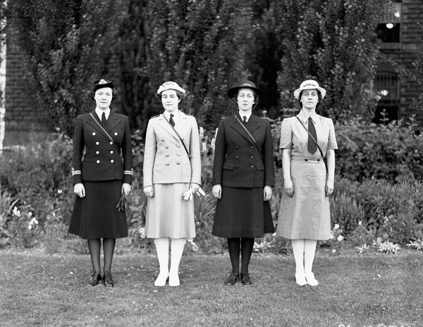 Unidentified personnel of the Women's Royal Canadian Naval Service (W.R.C.N.S.) modelling types of summer and winter uniforms, Ottawa, Ontario, Canada, 2 July 1942.