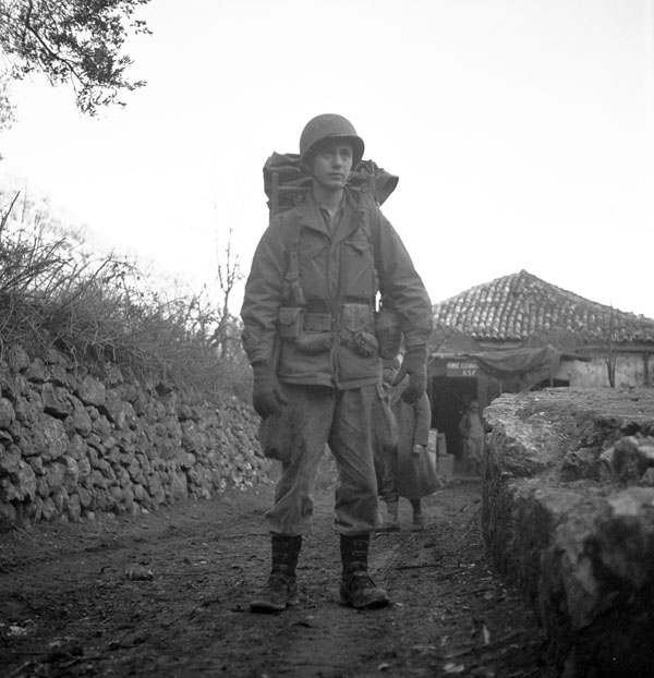 Lieut. W.H. Langdon, carrying full kit, joins up with his unit, the First Special Service Force north of Venafro, Italy, January 1944.