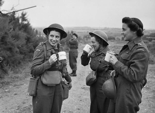 Nursing sisters of No.10 Canadian General Hospital, Royal Canadian Army Medical Corps (R.C.A.M.C.), having a cup of tea upon arriving at Arromanches, France, 23 July 1944.