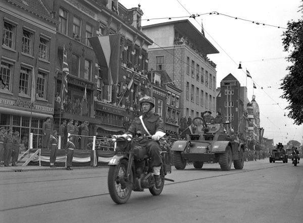 General H.D.G. Crerar taking the salute at a parade of the 3rd Canadian Infantry Division on the first anniversary of D-Day, Utrecht, Netherlands, 6 June 1945.