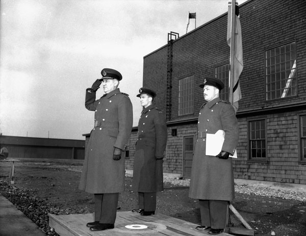 Air Vice-Marshal Leigh F. Stevenson, Air Officer Commanding Western Air Command, taking the salute at a parade, No.5 Operational Training Unit (Royal Canadian Airforce Schools and Training Units), Royal Canadian Air Force, Boundary Bay, British Columbia, Canada, 16 February 1944.