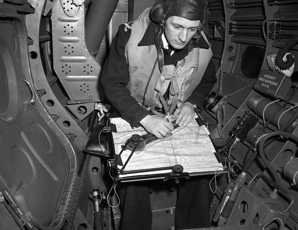 Lieutenant A.W. Turney in the observer's position of a Grumman Avenger aircraft No.852 Squadron, Fleet Air Arm, aboard H.M.S. NABOB, February 1944.