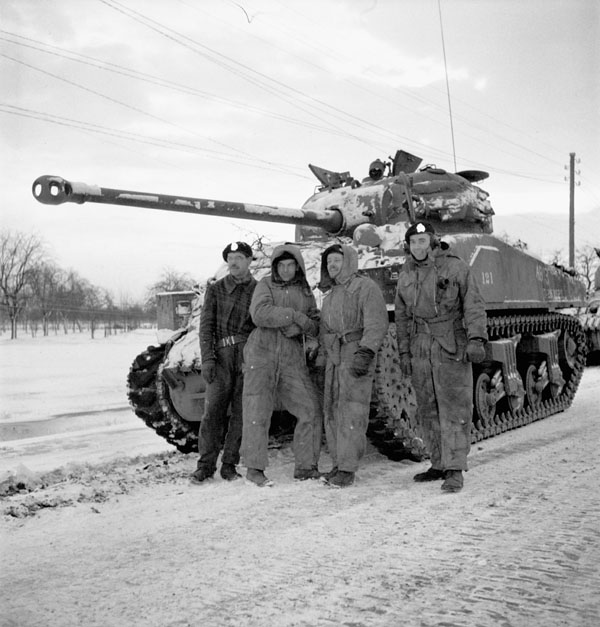 Tank crew with their Sherman Vc Firefly tank of the 1st Hussars near Zetten, Netherlands, 20 January 1945.