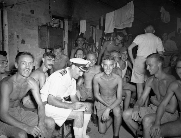 Canadian and British prisoners-of-war  liberated by the boarding party from H.M.C.S. PRINCE ROBERT, Hong Kong, August 1945.