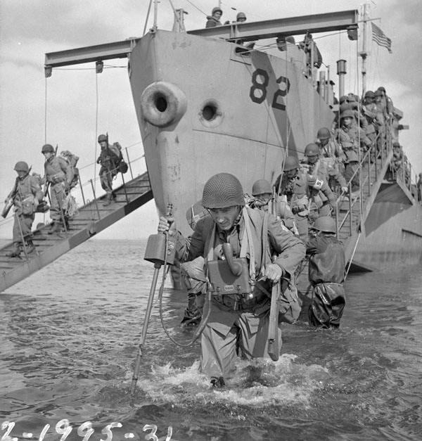Infantrymen of the 13th Infantry Brigade Group disembarking from a landing craft during Operation COTTAGE, the invasion of Kiska, Aleutian Islands,  16 August 1943.