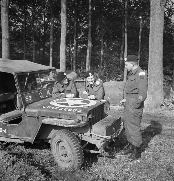 Personnel of the British Columbia Regiment with a jeep, near Brasschaet, Belgium, 14 October 1944.