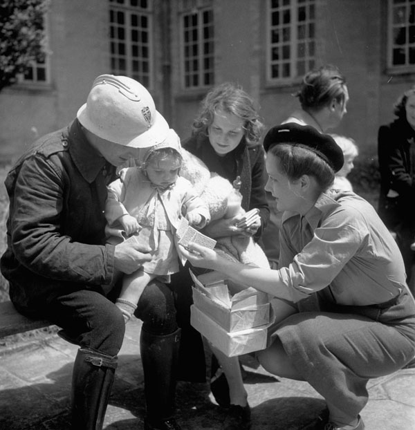French civilians who were evacuated from Caen arriving in Bayeux, France, 13 July 1944.