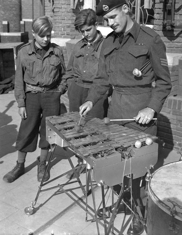 Sergeant P.R. Graham of the Canadian Armoured Corps (C.A.C.) Band playing a vibrophone, Nijmegen, Netherlands, 9 April 1945.