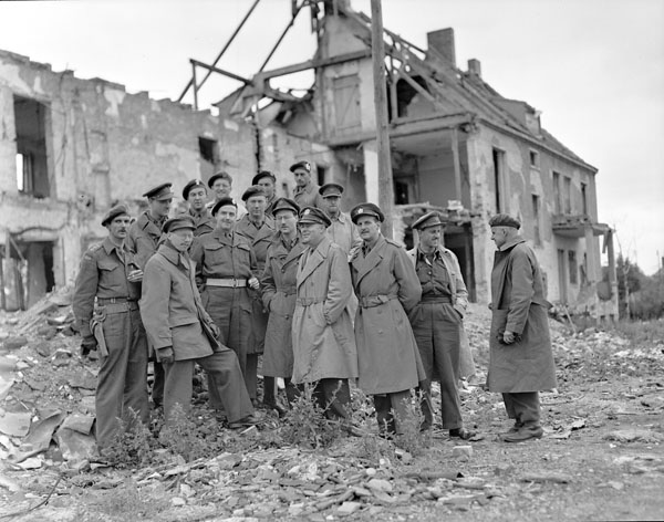 Colonel C.W. Gilchrist with a group of war correspondents, Berlin, Germany, 4 July 1945.
