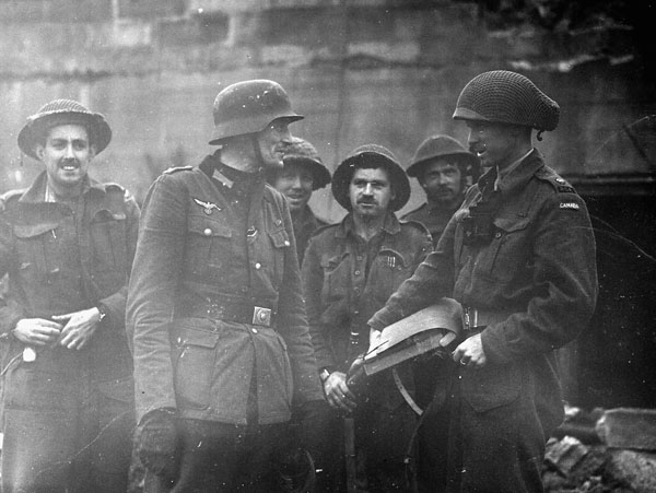 Canadian soldiers with the last German officer at the Mont Lambert fortification, Boulogne, France, 17 September 1944.