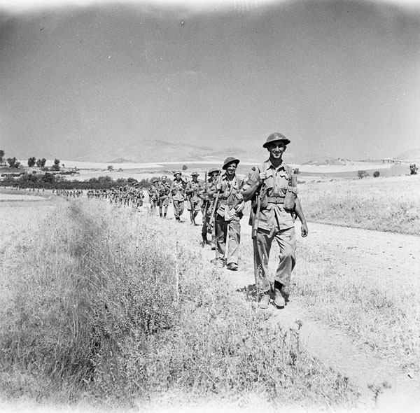 Infantrymen of the 48th Highlanders of Canada advancing towards Adrano, Italy, 18 August 1943.