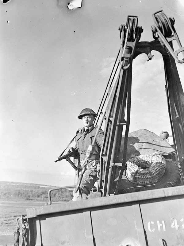 Unidentified soldier aboard a Diamond T969 wrecker vehicle of the Royal Canadian Ordnance Corps (R.C.O.C.), England, 25 September 1943.