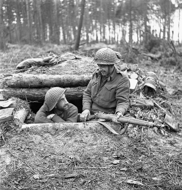 Infantrymen of the Queen's Own Cameron Highlanders of Canada in their dugout in the Hochwald, Germany, 5 March 1945.