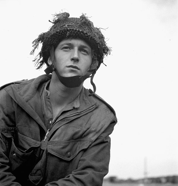 An unidentified paratrooper of the 1st Canadian Parachute Battalion at a transit camp near Down Ampney, England, June 1944.