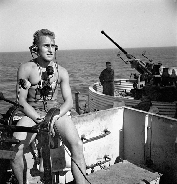 Private H.R. Stevens on Bofors gun duty aboard the troopship H.M.T. NEA HELLAS en route to Philippeville, Algeria, 5 July 1943.