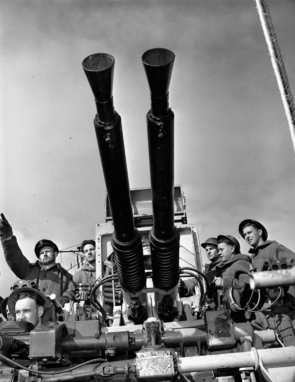 A Bofors 40 mm anti-aircraft gun crew on the destroyer HMCS Algonquin at action stations in Arctic waters.