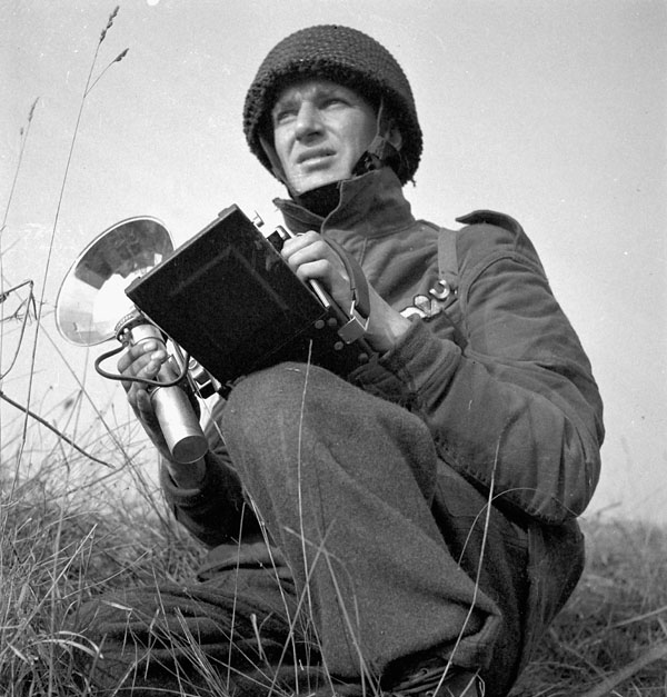 Sergeant David A, Reynolds, Canadian Army Film and Photo Unit, attached to the 1st Canadian Parachute Battalion, Bulford, England, 4 April 1944.