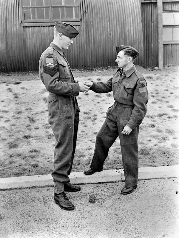 Sergeants D.R. Christianson and W. Irvine, candidates who have completed training at No.1 Parachute Training School, Royal Air Force (R.A.F.), in anticipation of serving with the First Special Service Force. Ringway, England, 12 September 1942.