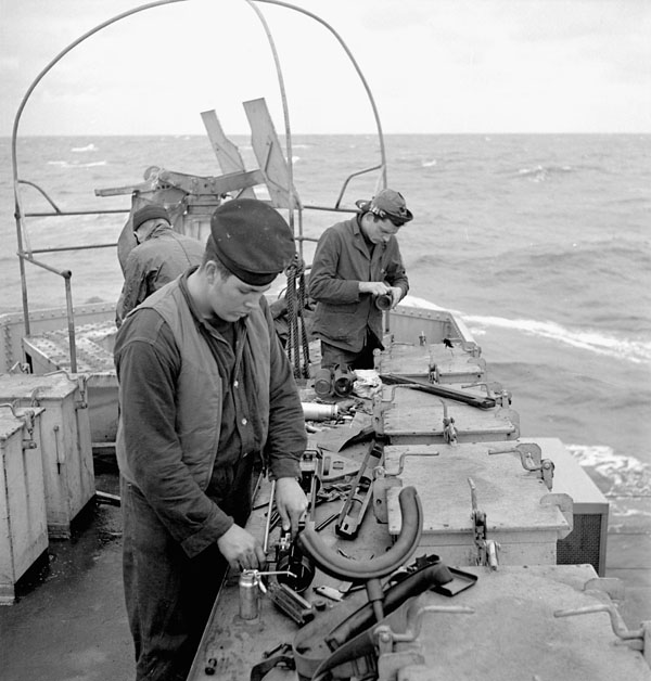 Personnel aboard a river-class frigate of the Royal Canadian Navy (R.C.N.) during workups off Pictou, Nova Scotia, Canada, February 1944.