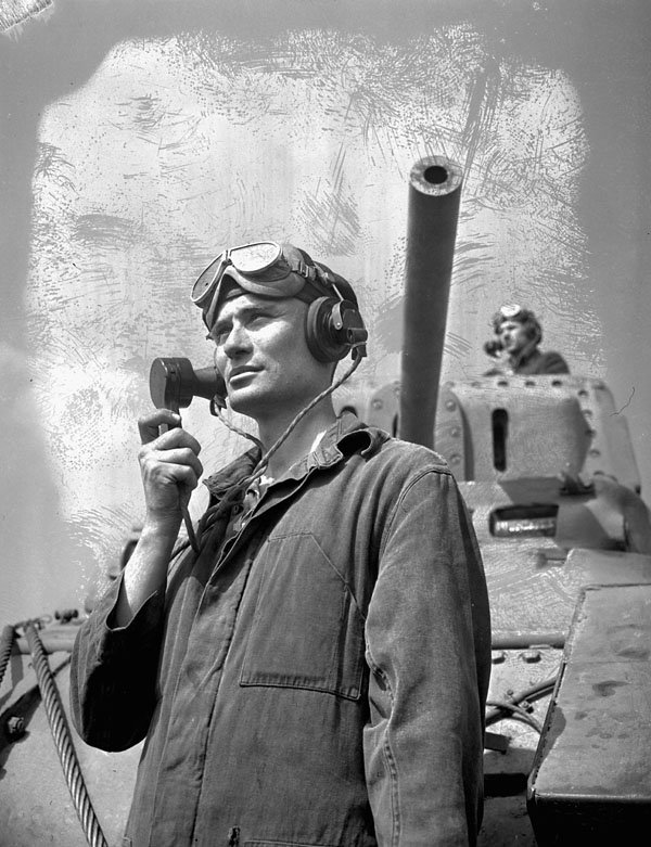 Unidentified radio operator and crew commander with a Ram tank at A33 Canadian Armoured Corps Training Establishment, Camp Borden, Ontario, Canada, 7 July 1943.
