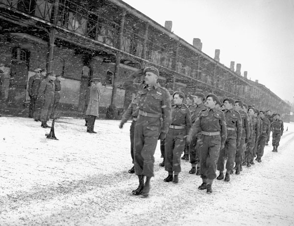 Major-General E.G. Weeks, Major General in charge of Administration, taking the salute at the final marchpast of No.1 Canadian Special Service Battalion, Aldershot, England, 9 January 1945.