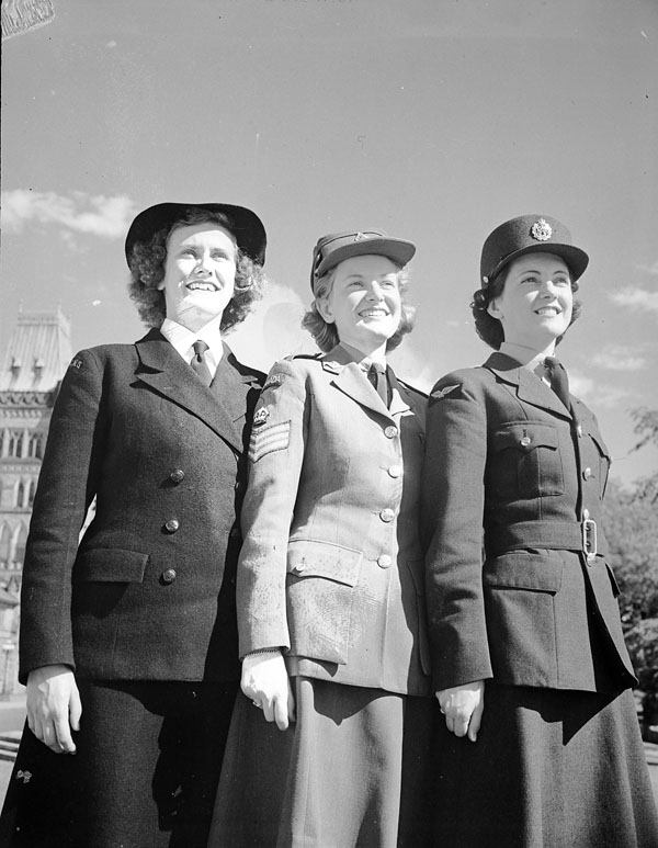 Unidentified members of The Women's Royal Canadian Naval Service (W.R.C.N.S.), the Canadian Women's Army Corps (C.W.A.C.) and the Royal Canadian Air Force Women's Division (WD) on Parliament Hill, Ottawa, Ontario, Canada, July 1943.