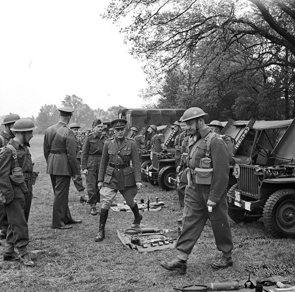 Lieutenant-General A.G.L. McNaughton and Major-General Georges P. Vanier inspecting the vehicles and equipment of the 3rd Battalion, Royal Canadian Engineers (R.C.E.), England, 6 May 1943.