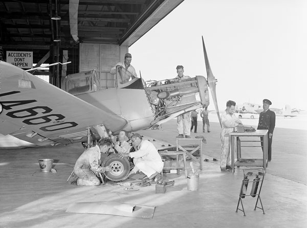 Groundcrew servicing a Fairchild Cornell I aircraft of No. 19 Elementary Flying Training School, RCAF.